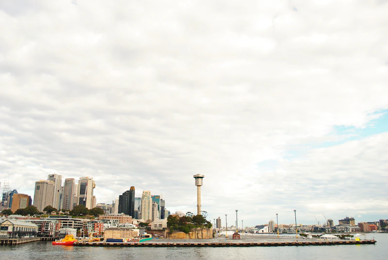 a city skyline with a tower